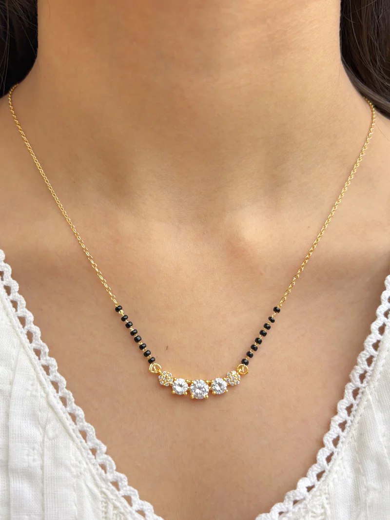 Double Strand Mangalsutra
Triple Diamond Pendant Mangalsutra
Black Bead Mangalsutra Necklace
Bridal Mangalsutra Design
Round Diamond Mangalsutra